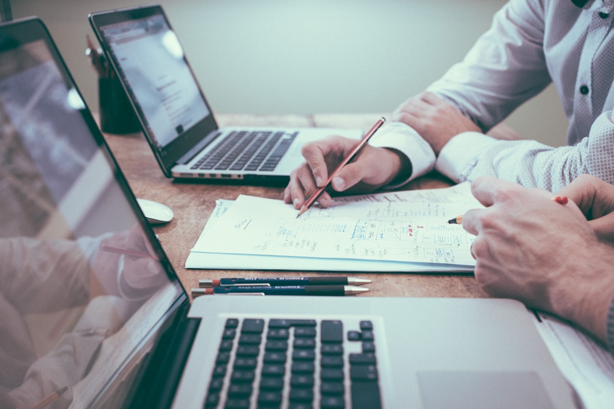 Claims professionals reviewing large loss property claim documentation